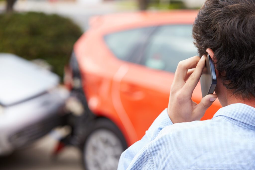 teenage driver calling for help after a car accident