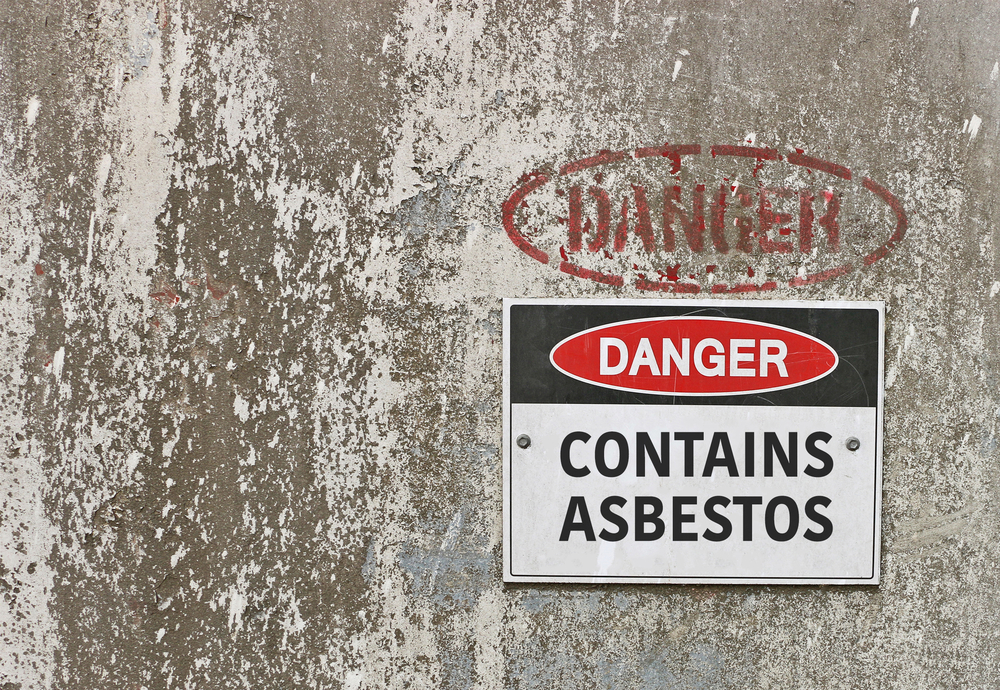 Warning sign containing asbestos danger for Nashua asbestos lawyer page