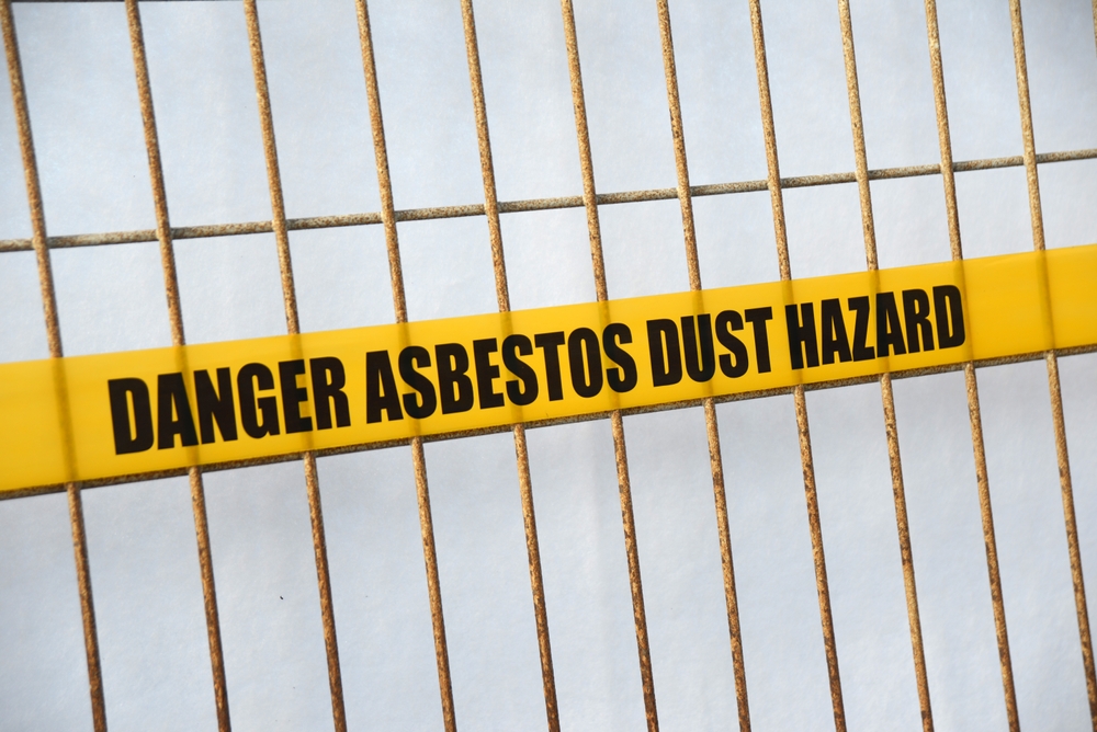 Warning sign containing asbestos danger for Nashua asbestos lawyer page