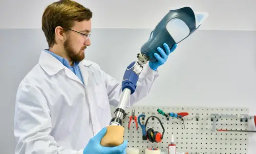 doctor examining a prosthetic leg
