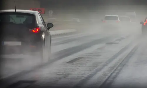 car driving on wet highway