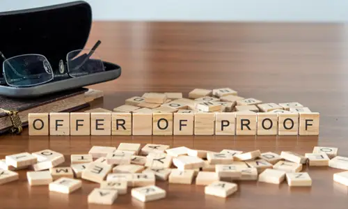 Scrabble tiles reading "offer of proof"